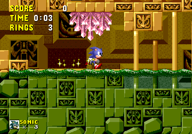 Screenshot of Labyrinth zone 1 in Sonic 1, showing the water in the middle of the screen. The graphics look mostly orange above the water but they become green below it. The top of the water is covered with ripples made with sprites.